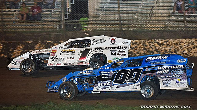 Tim Karrick (1k) battles with Jim Moody (00) at the Central Missouri Speedway.