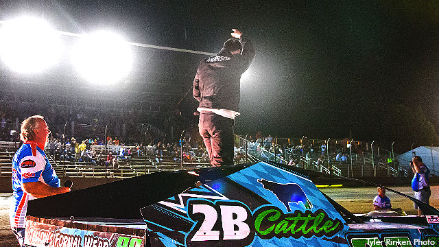 Kyle Anderson celebrates after winning the Out-Pace USRA B-Mod feature at the Upper Iowa Speedway.
