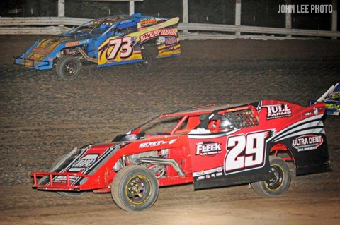 Shad Badder (73) of Oak Grove rides the high side around leader Dennis Elliott in the USRA Modified feature at the Valley Speedway on Saturday, May 12.