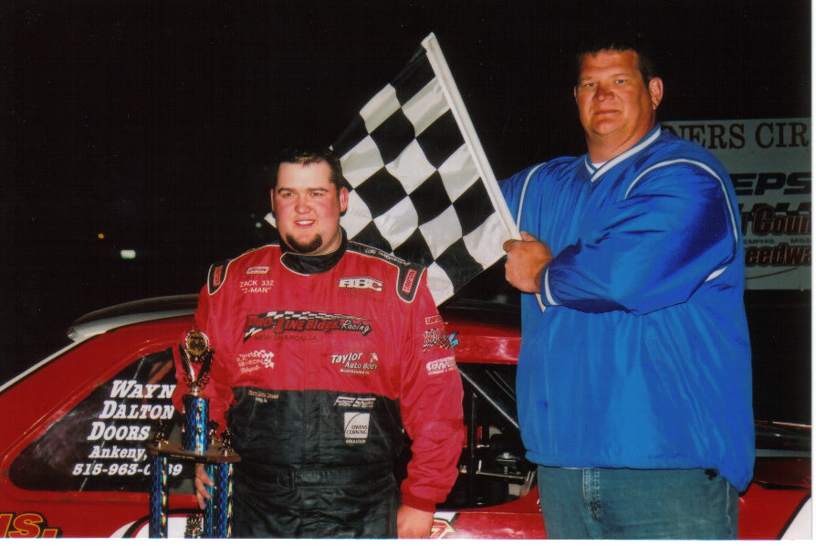 New Sharon, Iowa's Zack VanderBeek claimed his second consecutive USRA Stock Car feature win at the Pepsi Scotland County Speedway on Saturday, May 6. Also pictured is flagman Kevin Eggleston. (Brian Neal photo)