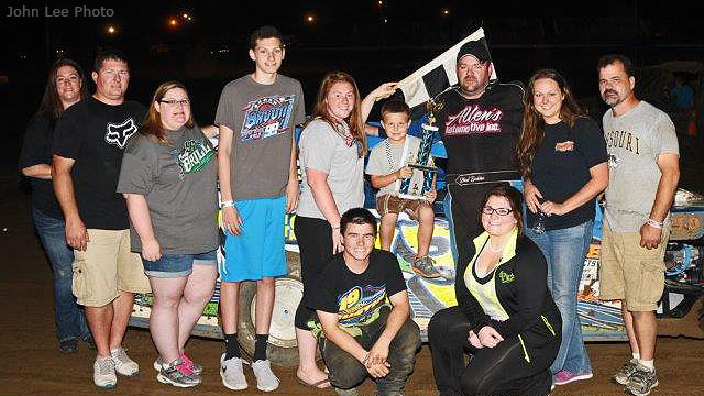 Shad Badder is joined by family and crew members in victory lane after winning the USRA Modified feature on Saturday, Aug. 22, at the Central Missouri Speedway.