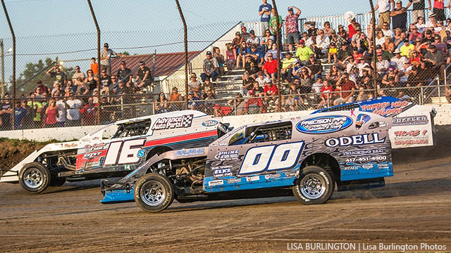 Jim Moody (00) competes with Kerry Davis (16) and Kevin Blackburn (hidden) in an early season USRA Modified heat race at Central Missouri Speedway.