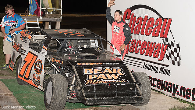 Jason Cummins celebrates in victory lane after his second straight USRA Modified feature win on Friday, Aug. 21, at the Chateau Raceway in Lansing, Minn.