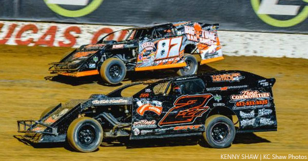 Eventual feature winner Darron Fuqua (87) battles Chase Domer on the final lap of the USRA Modified main event on Saturday, May 12, at the Lucas Oil Speedway.