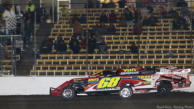 Kerry Davis edges out Darron Fuqua by a half-car-length to win the USRA Modified feature at the Lakeside Speedway on Friday, April 3.