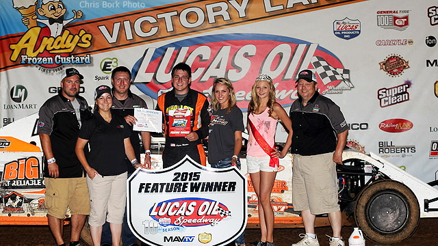 Logan Martin is joined by family and crew members in victory after winning the USRA Modified main event on Saturday, Aug. 22, at the Lucas Oil Speedway in Wheatland, Mo.