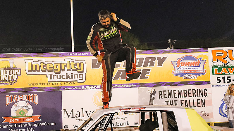 Jason Songer celebrates after winning the Cook Racing Supplies USRA Hobby Stock feature.
