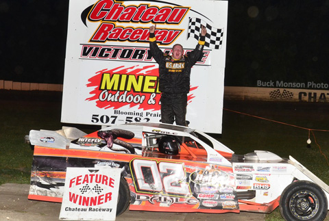 After a few doughnuts and burn-outs on the front-stretch for the fans, Jacob Dahle celebrates in victory lane Friday night at the Chateau Raceway.
