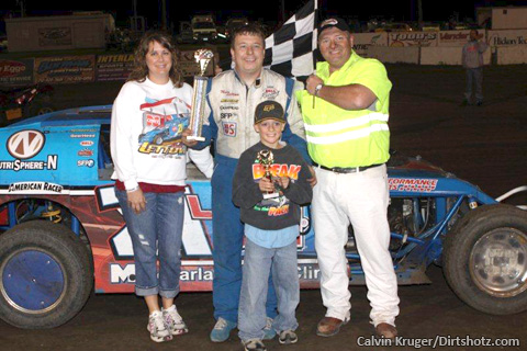 Matt Lettow celebrates in victory lane after his win at the Rapid Speedway.